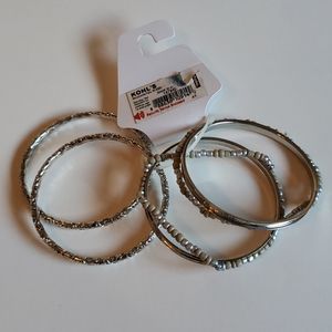 Set of (x 4) Silver-colored bracelets...